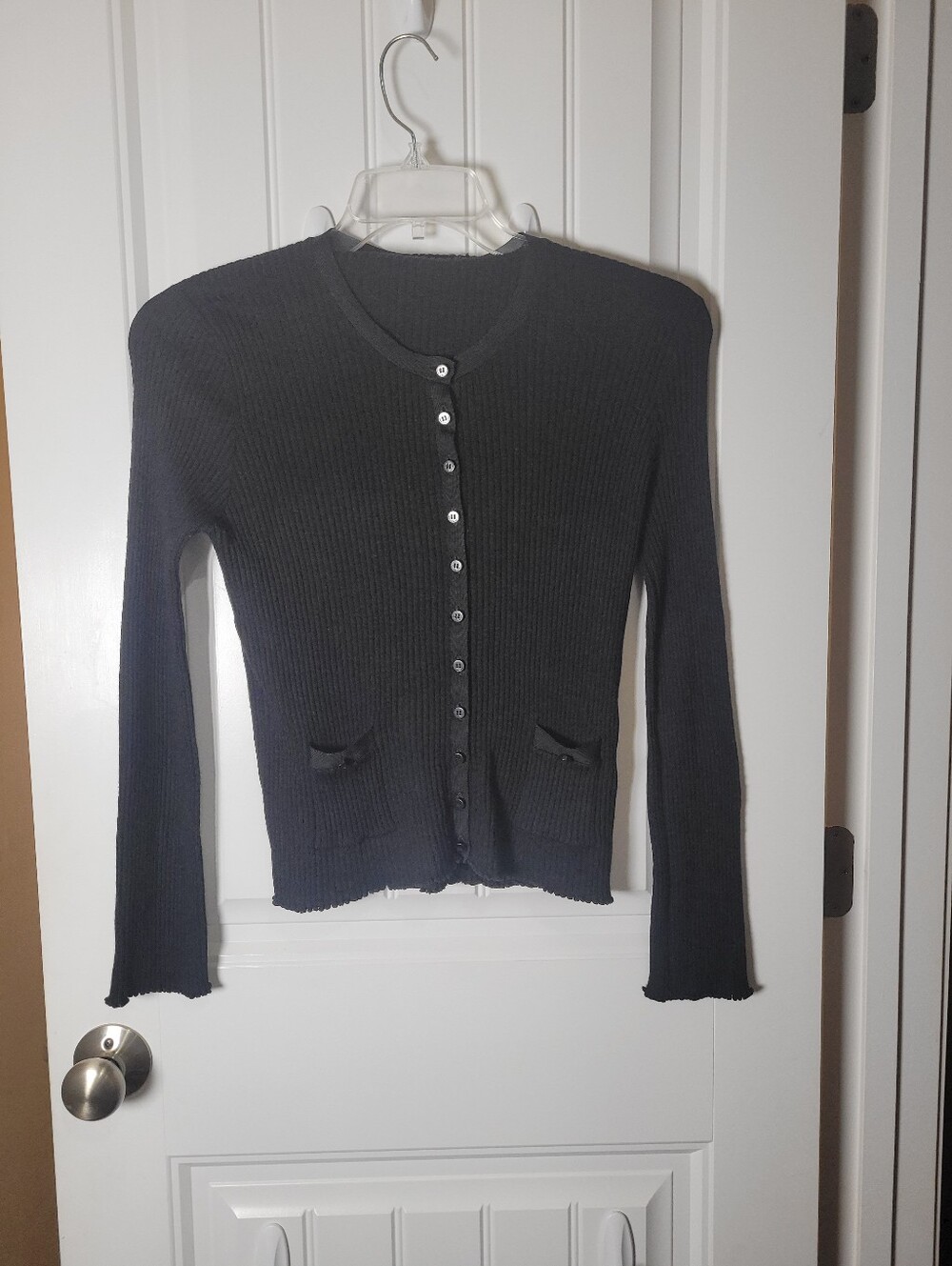 The Unbranded 100% Merino wool Black Ribbed Button-Front Women's Sweater.